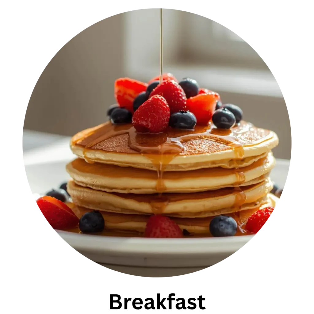 Fluffy pancakes served with maple syrup for breakfast.