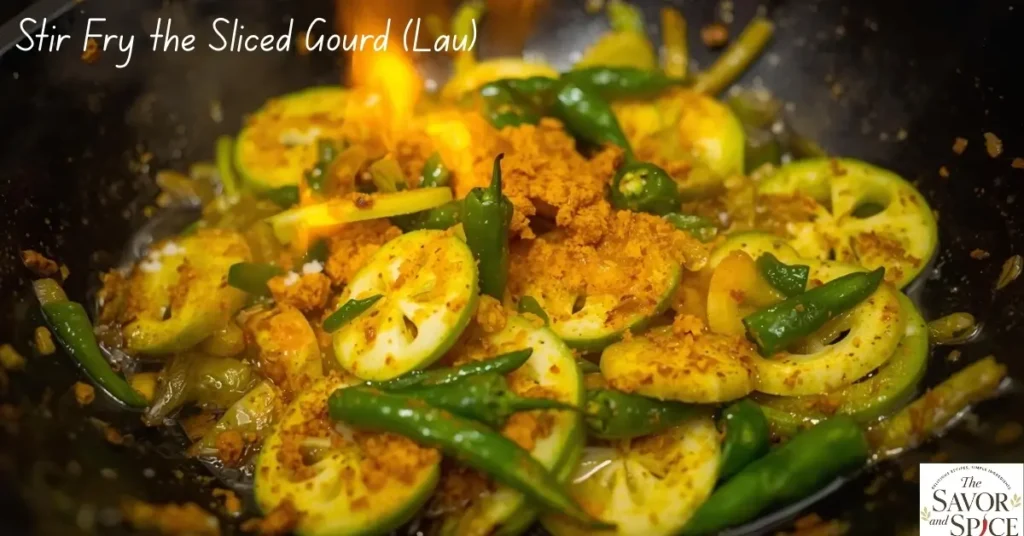 Pan-frying chopped bottle gourd with aromatic Bengali spices for a quick and flavorful Lau Chingri Bhaja.