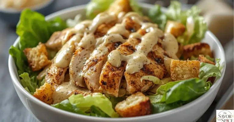 Healthy chicken Caesar salad high-protein with grilled chicken, romaine lettuce, and parmesan in a white bowl